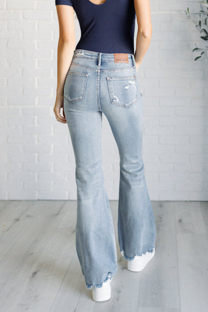 Mid Rise Control Top Distressed Flare Jeans